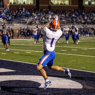 football player scoring touchdown