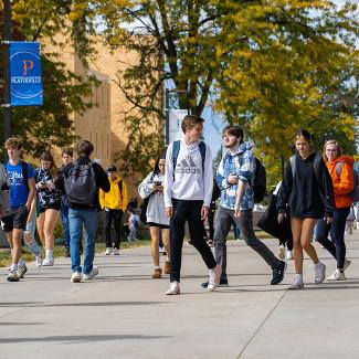 UW-Platteville students walking across campus in the fall