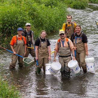 UW-Platteville students collecting fish samples from a local stream