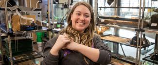 Emma Skrepenski in Animal House working with snake