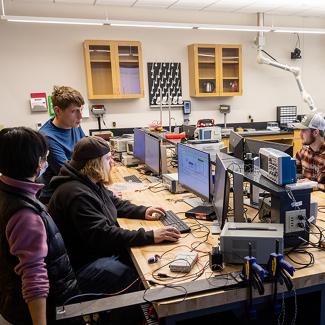 students working in Measurement and Instrumentation Lab with faculty