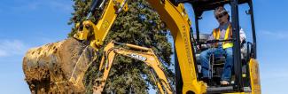 UW-Platteville student runs backhoe