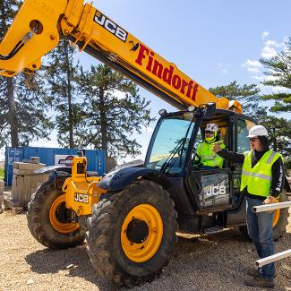 Student in excavator at UW-Platteville Construction Lab