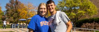 Smiling UW-Platteville students standing outside on fall day