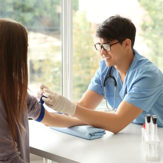 Nurse drawing blood