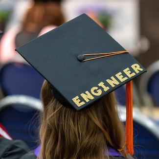 back view of UW-Platteville EMS graduate wearing grad cap with Engineer written on it