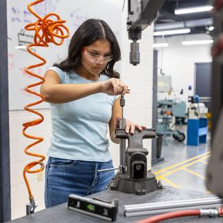 UW-Platteville student use vise clamp in HUFF Innovation Center