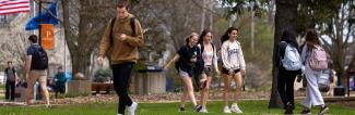 UW-Platteville students walking to class on a spring day