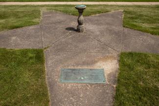 World War I Memorial with tablet set in concrete star with sundial in the center