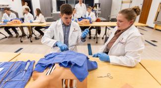 Physician assistant students practice medical skills