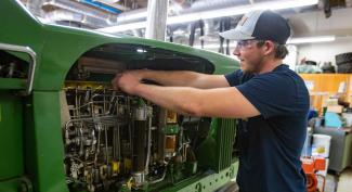 UW-Platteville student working on tractor engine