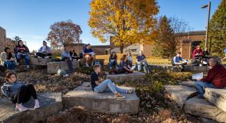 UW-Platteville sociology class sitting outside on sunny fall day