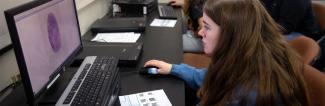 UW-Platteville student works in criminal justice lab on fingerprint analysis.