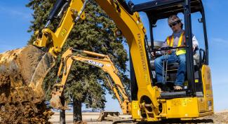 UW-Platteville student runs backhoe in lab