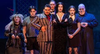  UW-Platteville student performing on stage in full costume