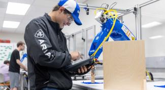 Engineering Technology Management student working with machinery