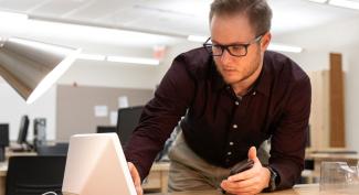 UW-Platteville student works with digital device in lab