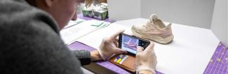UW-Platteville student takes photo of tennis shoe for database