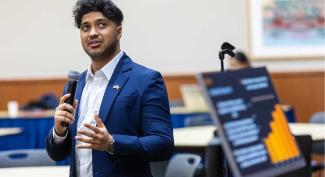 UW-Platteville finance student gives presentation that includes a bar graph