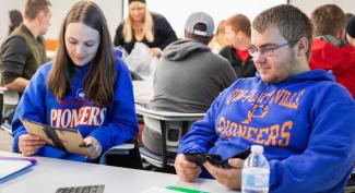 UW-Platteville students collaborate in small groups doing class.