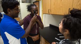 UW-Platteville faculty member demonstrates procedure for eye exam 