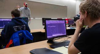 UW-Platteville students sit in classroom working on drafting coursework