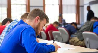 UW-Platteville students focus on writing while sitting in an Ethnic Studies class