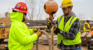 UW-Platteville students working with heavy construction equipment