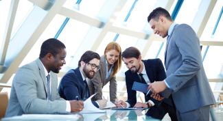 Group of business professional collaborate around a table