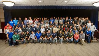 A large group of students, alumni, and faculty of the UW-Platteville construction management program