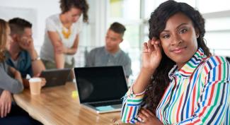 successful online student working on laptop with team