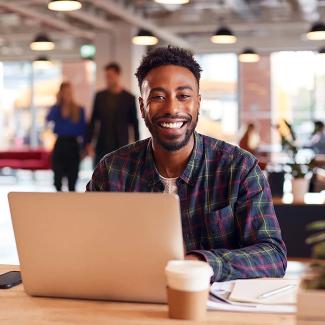 Smiling student with laptop