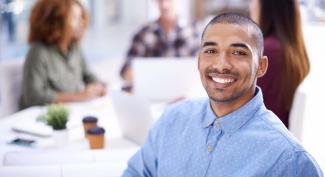  online student at work with coworkers collaborating in background