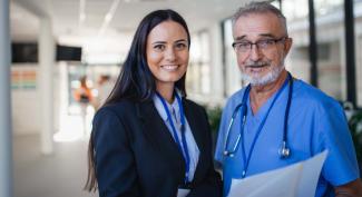  healthcare administrator working with doctor