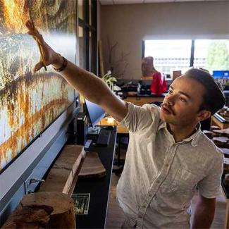 UW-Platteville student studies tree rings in the lab