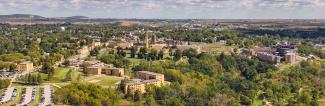 aerial photo of Platteville, Wis. with UW-Platteville campus in foreground and Platte Mound with large M in the background