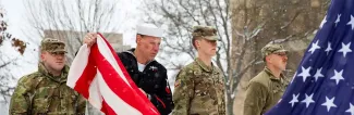 UW-Platteville student veterans raising the US flag in a ceremony
