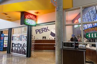 View from outside of the UW-Platteville cafe, with lighted Pioneer Perk sign