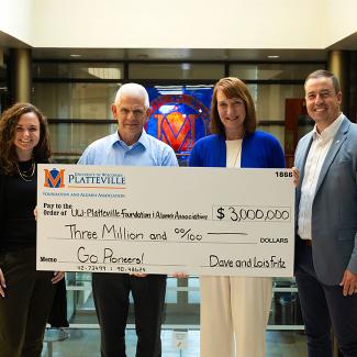 Four individuals smiling and holding a large check made out to the UW-Platteville Foundation in the amount of $3 million.